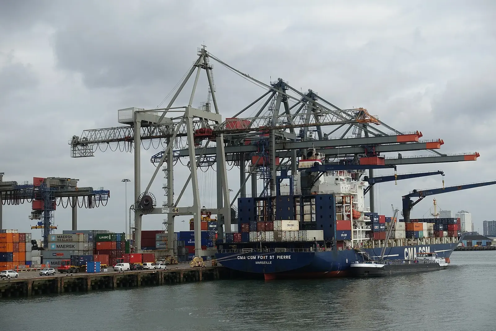 Container cranes and stacked freight at a deep-water port terminal